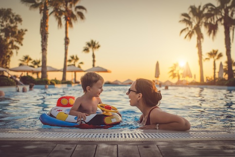 child and lady in pool