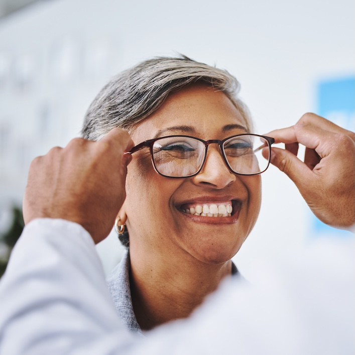 lady trying on glasses