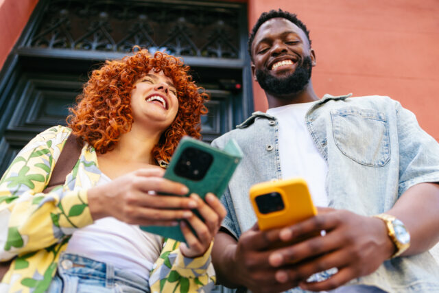 Two Gen Z employees reviewing health benefits options together